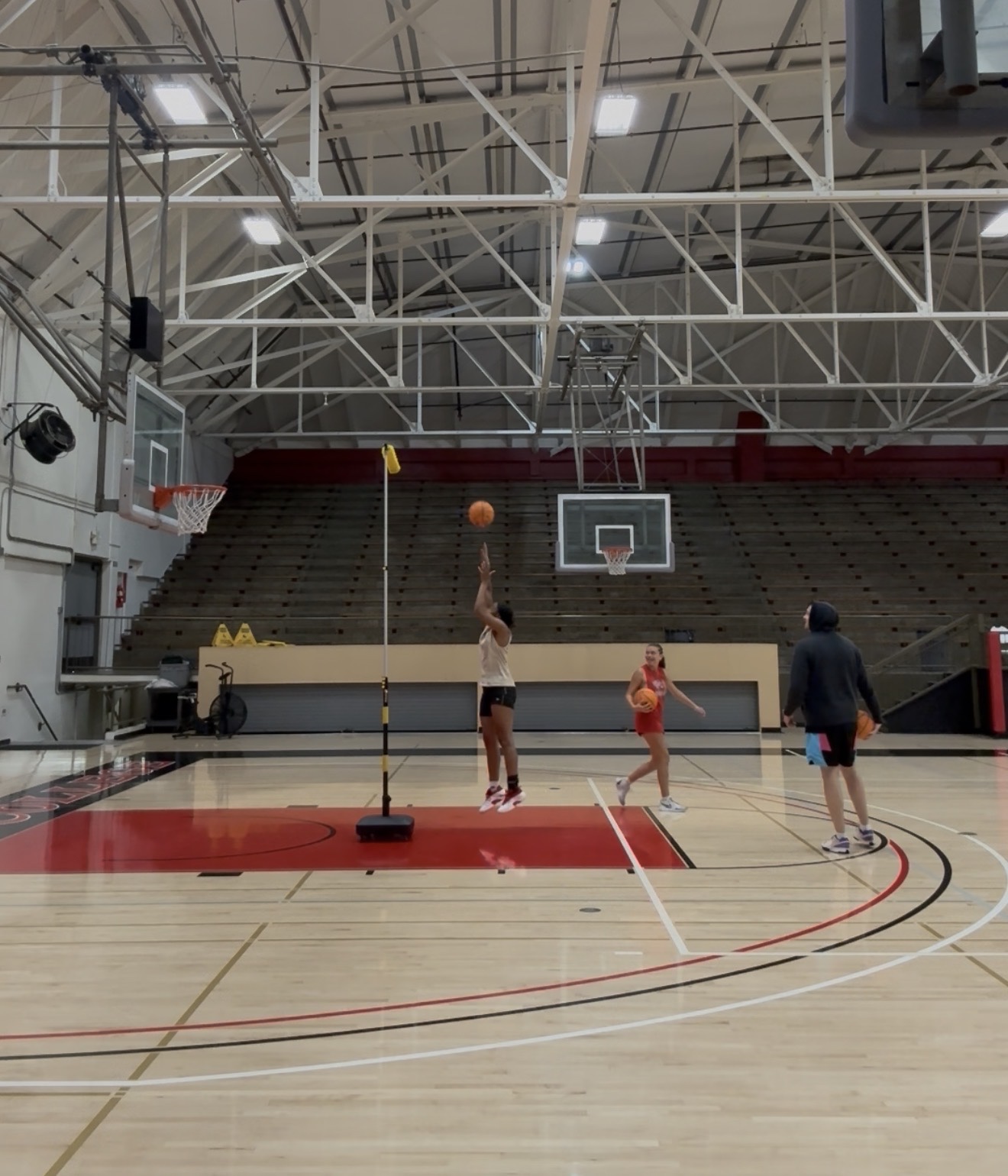 Wide view of a soft-touch finish rep with The Archer on the red lane